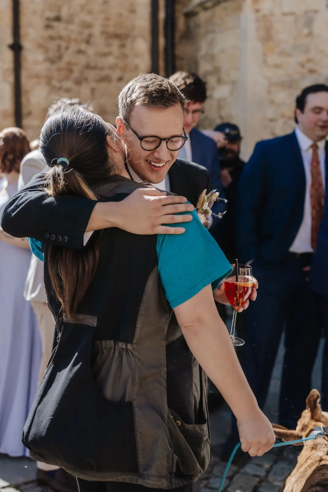 A Quality Chops wedding chaperone with a guest and their dog